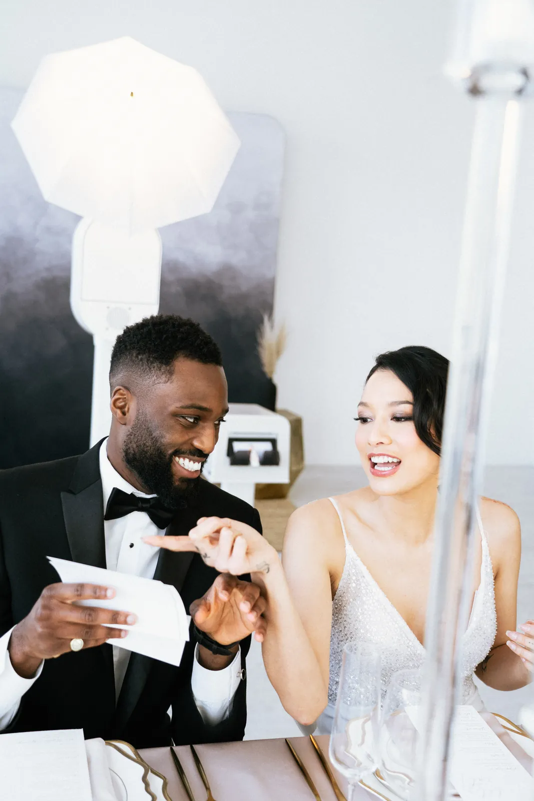 Couple holding their photo booth prints