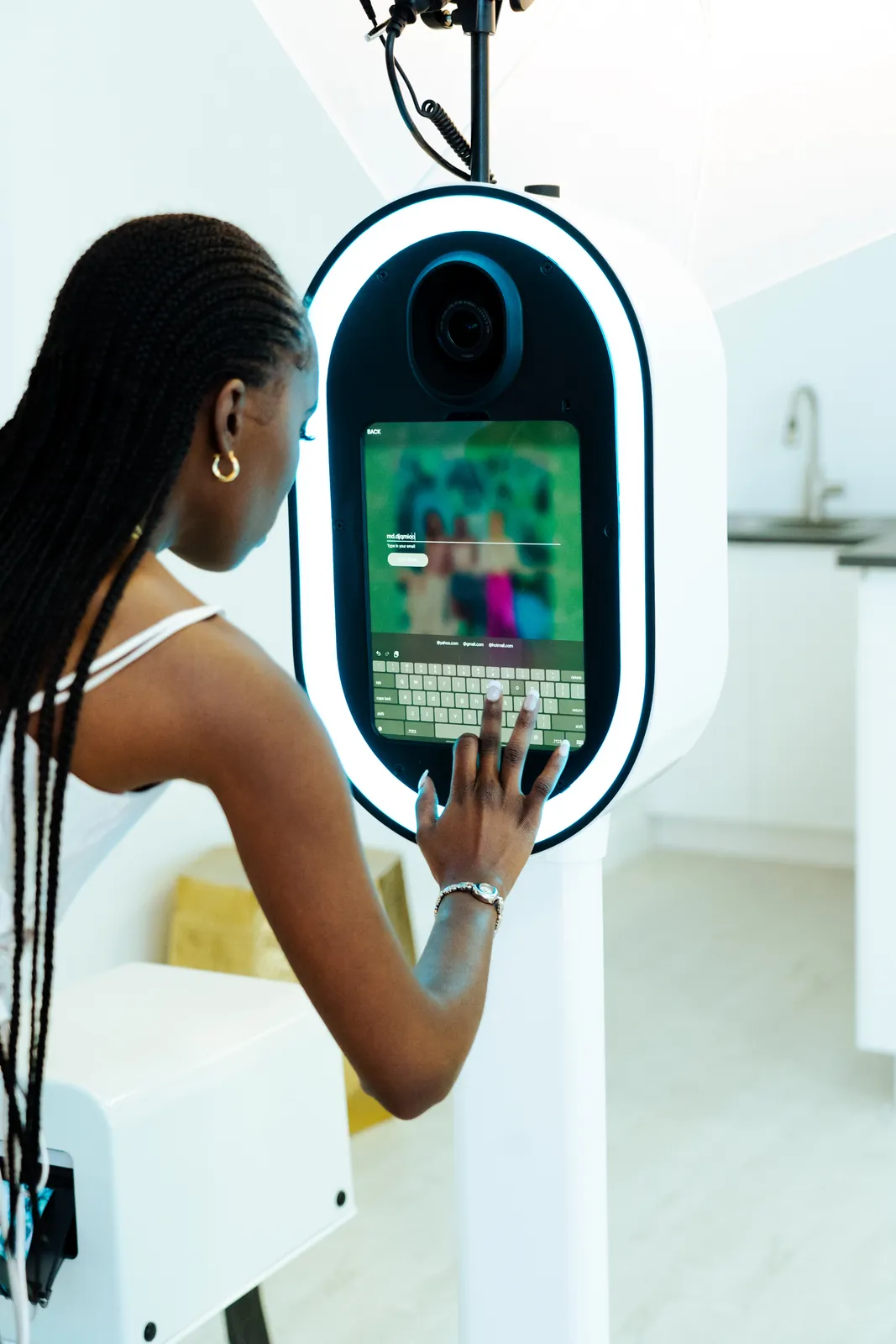 Guest using the booth touch screen