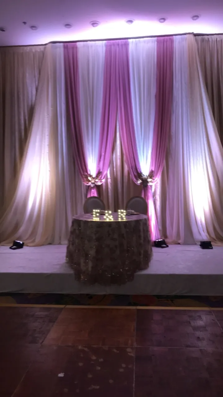 Head table with lit drapes